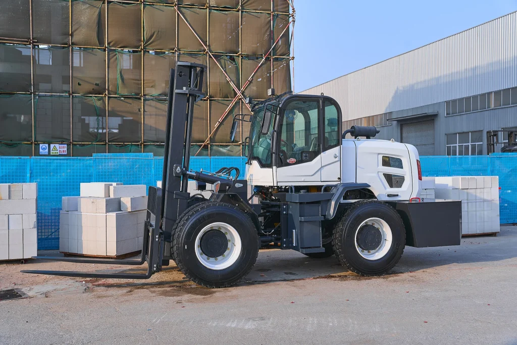 T60 rough terrain forklift side view showing complete machine profile, load handling capability, and industrial construction in factory yard setting